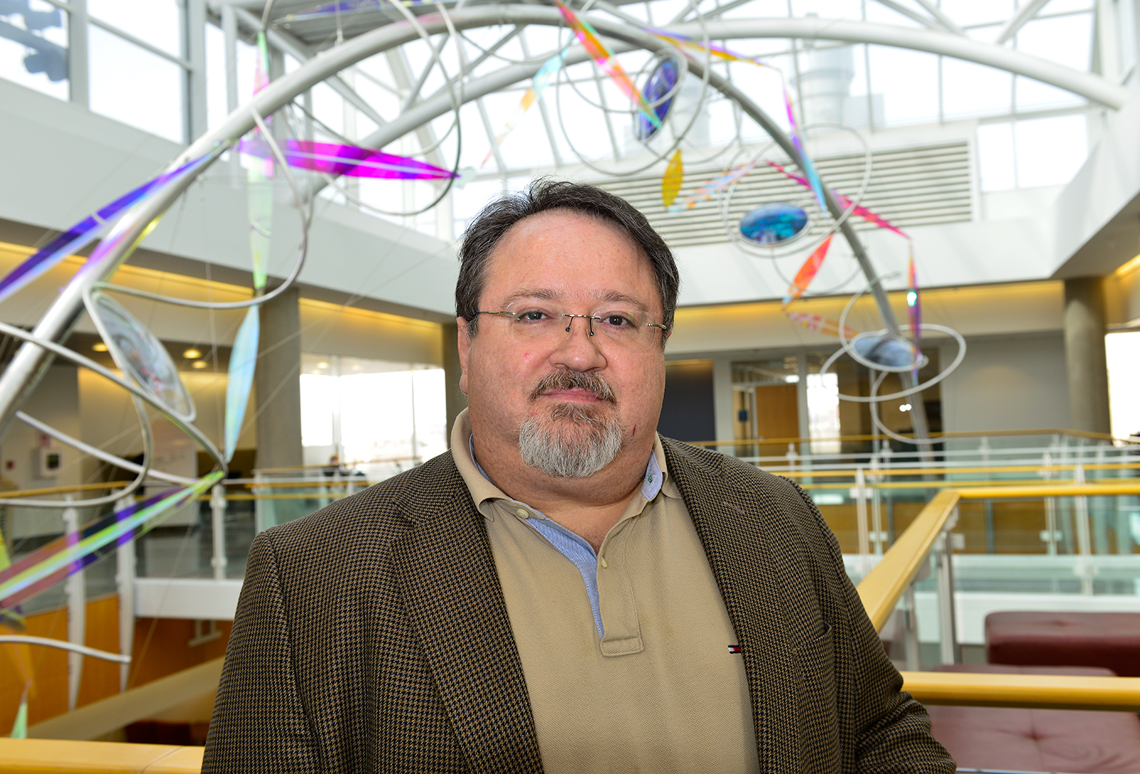 Virologist Stefan Sarafianos stands in the atrium of the Bond LSC. 
