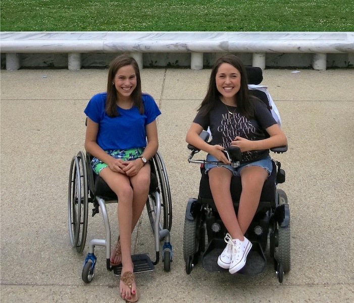 Lauren,17 (left) and Claire, 16 (right), say their shared SMA diagnosis has strengthened their relationship and presented them with opportunities to travel and share their experiences. | Photo provided by the Gibbs family.